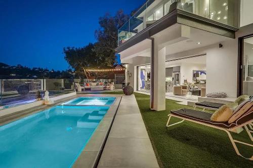 a large house with a swimming pool in a yard at Troy Hill in Los Angeles