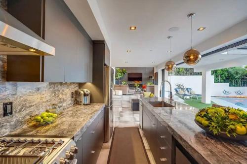 a kitchen with a counter with a bowl of fruit on it at Troy Hill in Los Angeles