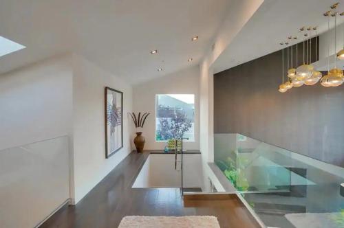 a hallway with a glass table and a window at Troy Hill in Los Angeles