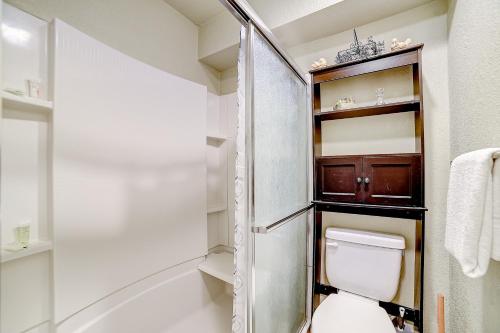 a small bathroom with a toilet and a shower at 1185 Parkview Dr Unit 22 in Canyon Lake