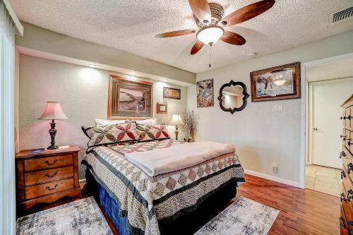 a bedroom with a bed and a ceiling fan at 1185 Parkview Dr Unit 22 in Canyon Lake