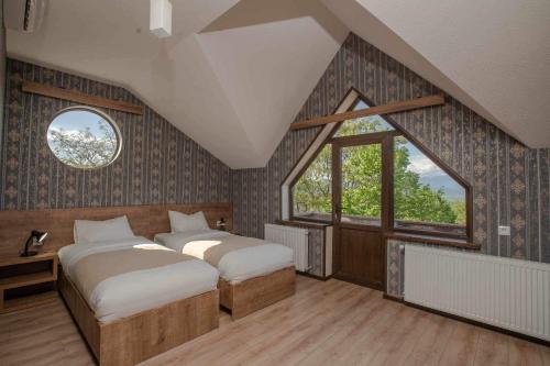 Postel nebo postele na pokoji v ubytování Chateau Orberi