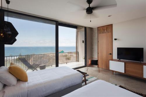 Postel nebo postele na pokoji v ubytování Eolia Sustainable Design Hotel