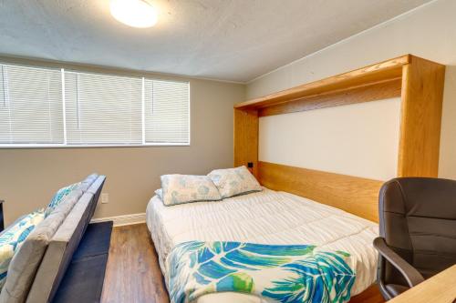 a bedroom with a bed and a chair in it at Pet-Friendly Gulfport Home Less Than 2 Mi to Beach in St Petersburg