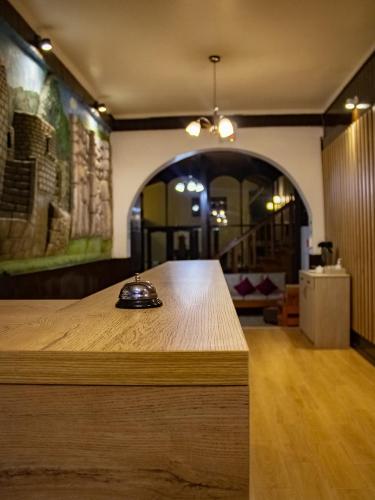 a room with a table with a phone on it at Hotel Santa Maria in Cusco