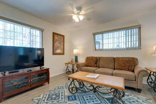 a living room with a couch and a flat screen tv at Pool Access Homosassa Home Near Boat Launch! in Homosassa
