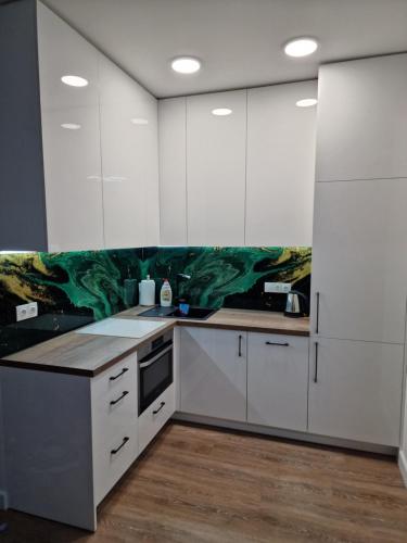 Kuchyň nebo kuchyňský kout v ubytování Apartamentai Ragaines self chec-in free parking
