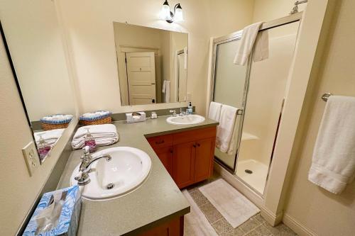 a bathroom with a sink and a mirror at Marty's Place in Langley