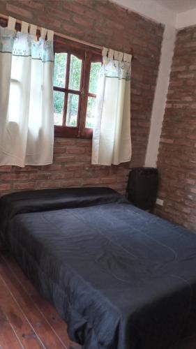 Postel nebo postele na pokoji v ubytování Alojamiento Los Amigos