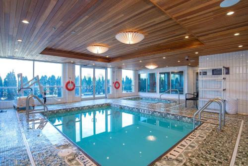 a pool in a hotel room with at Sandman Hotel Hamilton in Hamilton