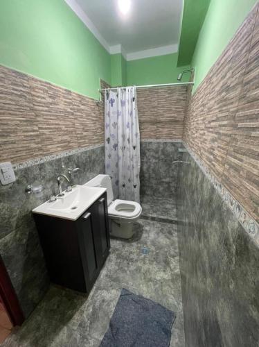 a bathroom with a sink and a toilet in it at CANGO in Humahuaca