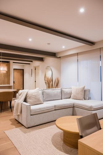 a living room with a couch and a table at Pancha Flats in Mexico City