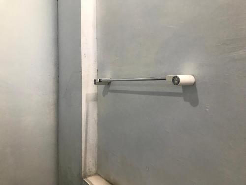 a metal door with a roll of toilet paper on it at Bello Bungalow in Batukliang