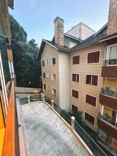 a view from the balcony of a building at Apto a 3 minutos da Rua Coberta de Gramado in Gramado