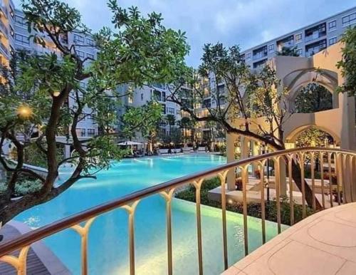 a view of a swimming pool from a balcony at A luxurious and romantic at Lacasita Huahin by Pikul in Hua Hin