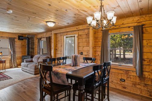 a dining room with a table and chairs at The Bucking Moose in West Yellowstone