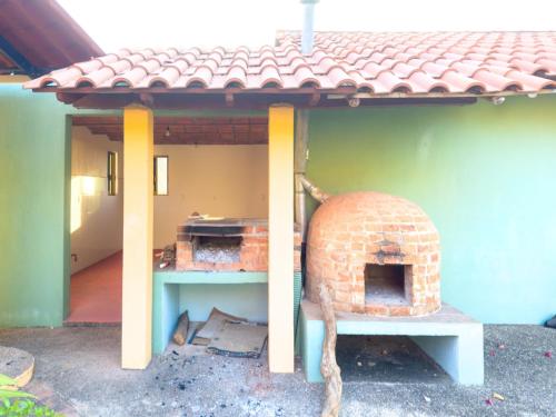 a brick oven sitting on the side of a house at Cerrito Encantado! Hidden Escape with Amazing Views 