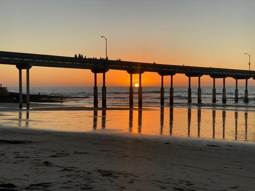 a pier on the beach at sunset at 5079 Lotus Street in San Diego
