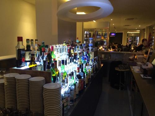 a bar with a lot of bottles of alcohol at Il Portico in Fano
