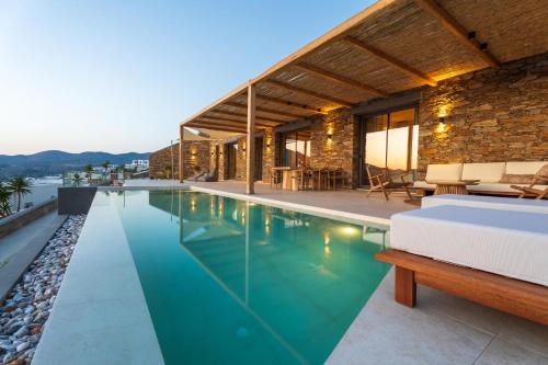 an image of a swimming pool in a house at Villa Mirabilis in Ios Chora
