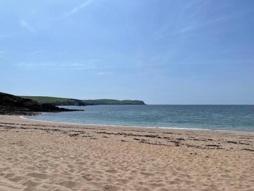 a sandy beach with the ocean in the background at Number 40 in Kingsbridge