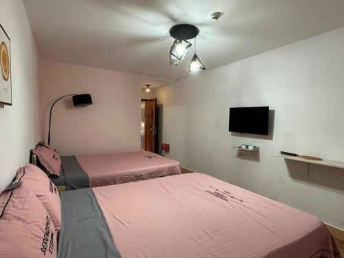Postel nebo postele na pokoji v ubytování Lin Jiang Apartment