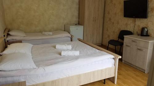 Postel nebo postele na pokoji v ubytování Guest House Green Rose