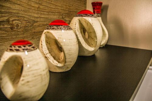 a group of four toilets in a room at Blu Apart Hotel in Mogi-Guaçu