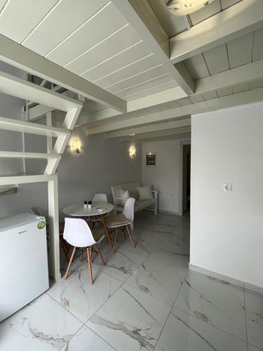 a living room with a table and chairs at Villa Pavlina in Karterados