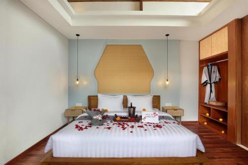Ένα ή περισσότερα κρεβάτια σε δωμάτιο στο Sanora Villa Sanur by Ini Vie Hospitality