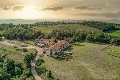 an aerial view of a house in a field at Ca' del Monte Resort in Serra del Monte
