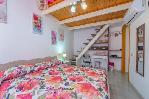 a bedroom with a bed and a staircase at domo nora in Olbia