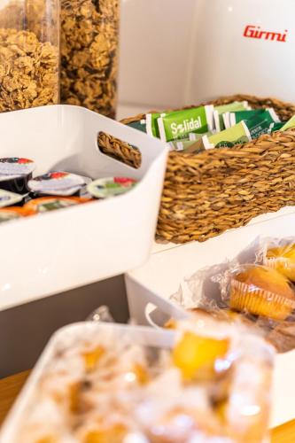 a table topped with boxes of food on a table at Sleep In Venzone in Venzone