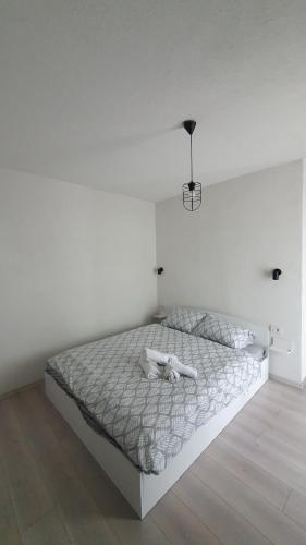 Кровать или кровати в номере Apartments KALE
