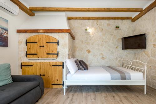 Postel nebo postele na pokoji v ubytování Apartment Oli