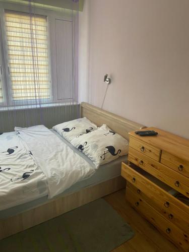 Voodi või voodid majutusasutuse Mieszkanko na Traugutta toas