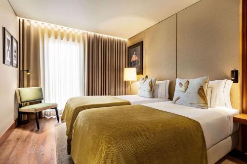 Katil atau katil-katil dalam bilik di Fontinha Porto, Trademark Collection by Wyndham