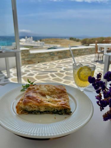 a piece of food on a white plate on a table at Cavos in Agios Sostis