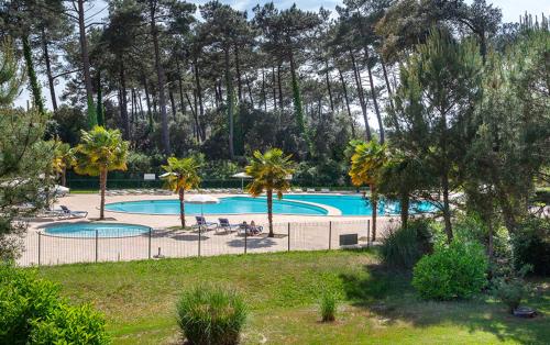 Πισίνα στο ή κοντά στο Les Dunes 6 personnes ,piscines ,tennis etc proche de la plage