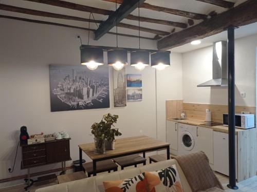 A kitchen or kitchenette at Apartamentos La Muralla