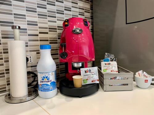 a red coffee maker sitting on top of a counter at Appartamento La Casa di Anna in San Severo
