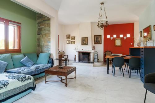 a living room with a couch and a table at Large Home near Potamos Beach in Epanomi