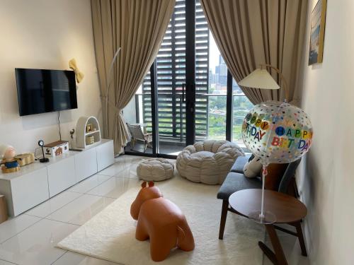 a living room with a dog laying on the floor at Luxury Studio Apartment with KL Breathtaking View in Kuala Lumpur