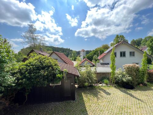 a house with a fence in a yard at Pia's Nature Retreat in Neukirch