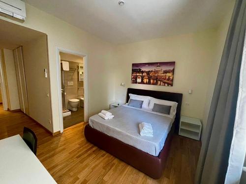A bed or beds in a room at Rienzo Vatican Suites