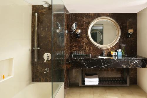 a bathroom with a sink and a mirror at Four Points by Sheraton Lahore in Lahore