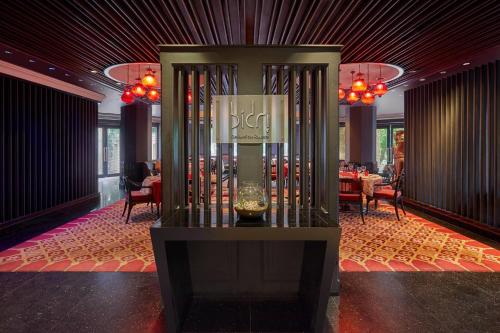 a lobby with a table and a vase in a room at Hyderabad Marriott Hotel & Convention Centre in Hyderabad
