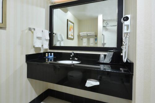 a bathroom with a black sink and a mirror at Fairfield Inn & Suites Wytheville in Wytheville