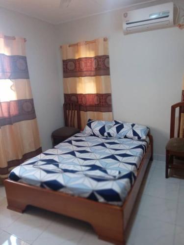 a bedroom with a bed in a room at Spintex Villas - Available for Long Term Rentals in Ablekuma