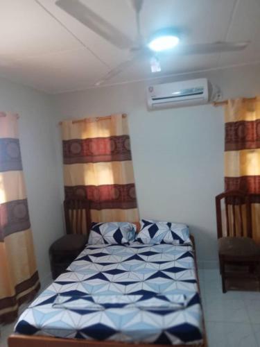 a bedroom with a bed in a room at Spintex Villas - Available for Long Term Rentals in Ablekuma